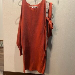 Burnt orange dress. Very good condition has open shoulder.